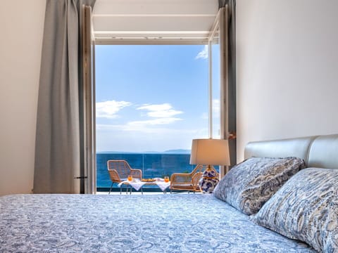 Blue, Furniture, Sea, Bedroom, Interior Design, Ocean, Linens, Bedding, Room, Bed