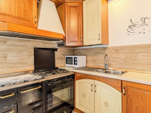 Kitchen, Countertop, Cabinetry, Wood, Flooring, Interior Design, Major Appliance, Kitchen Appliance, Floor, Furniture