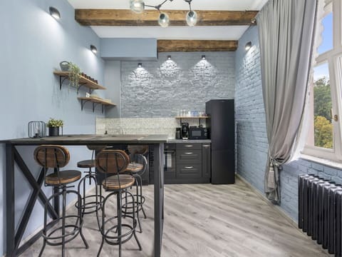 Furniture, Interior Design, Flooring, Wall, Kitchen, Wood, Floor, Countertop, Home, Light Fixture