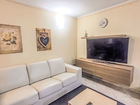 Furniture, Interior Design, Couch, Flooring, Floor, Wood, Living Room, Room, Television, Lighting