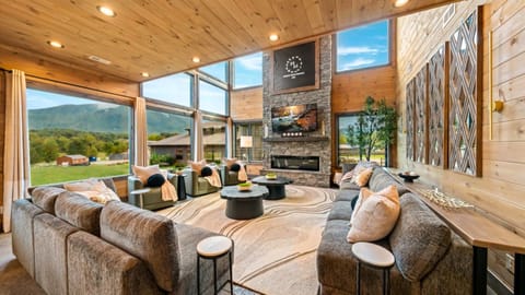 Welcome to Wonder Vue Lodge! A brand new cabin in the Smokies! Chill by the fire or catch up on your favorite show in the main living room!