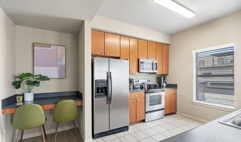 Fully stocked kitchen with dishwasher and laptop-friendly workspace