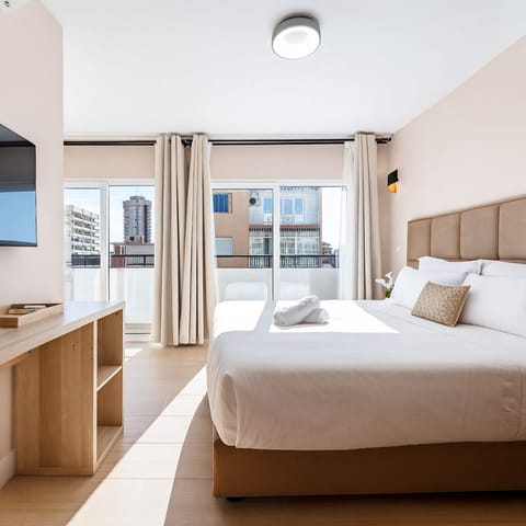 Studio, Balcony, City View | In-room safe, desk, blackout drapes, iron/ironing board