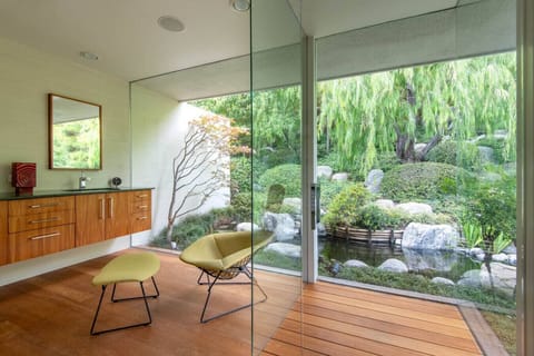 Primary bathroom has a shower overlooking a beautiful, private Japanese garden.
