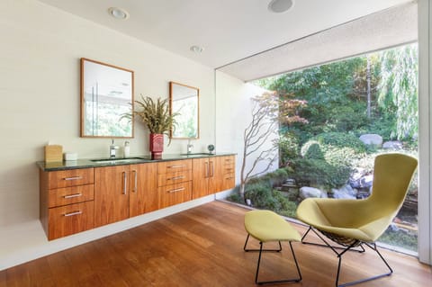 Primary bathroom with a shower overlooking a beautiful private Japanese koi pond