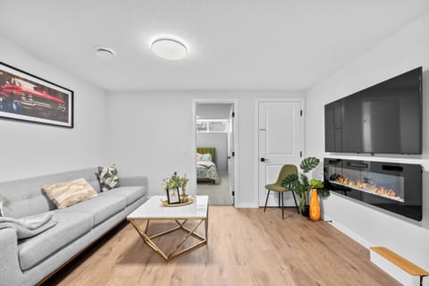 Living Room with 65 inch smart TV and electrical fireplace