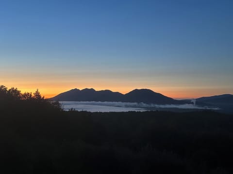 Sunrise view from the living room with fog over Flagstaff Lake 