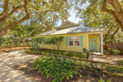 Front view of single-story yellow house