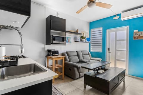 Bright living space with comfy seating and beachy vibes.