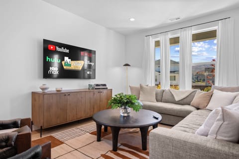 Sink into the oversized sofa, sip a warm drink, and watch the sunset over the mountains.