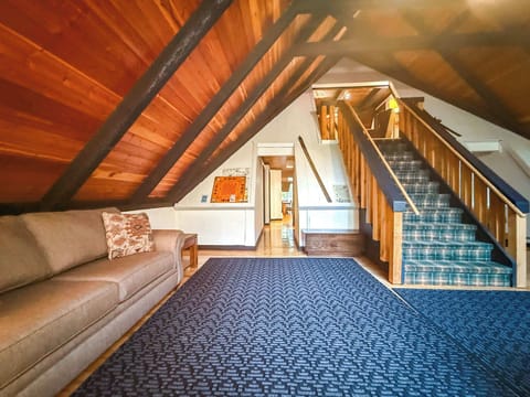 To the left in the entryway you'll find the couch and one of the hallways to the rest of the home. 