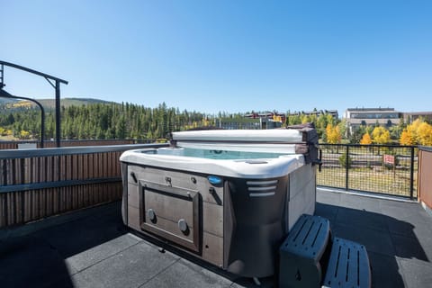 Soak in your private hot tub while enjoying sweeping views of forests and autumn foliage from this elevated terrace.