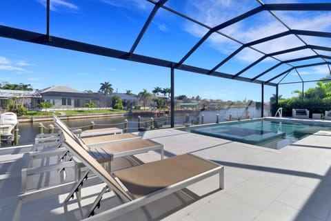 Multiple sunloungers and outdoor seating provide space for everyone to comfortably enjoy the outdoor space.