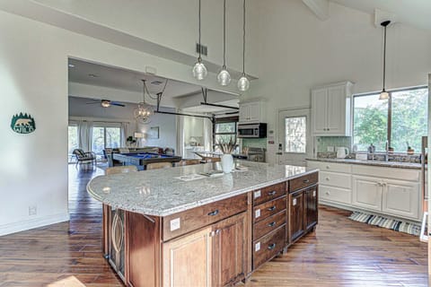 Chef's kitchen with granite counters and stainless appliances
