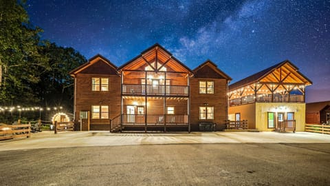 Game Time Retreat is a large, luxurious cabin that is 5,800 square feet and has Waterfall, Firepit, an EPIC Game Room, Indoor Pool, Outdoor Theater, Spa, Outdoor Sauna and More!
