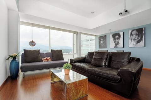 Design Apartment, 2 Bedrooms, City View, Tower | Living area | 50-inch Smart TV with digital channels