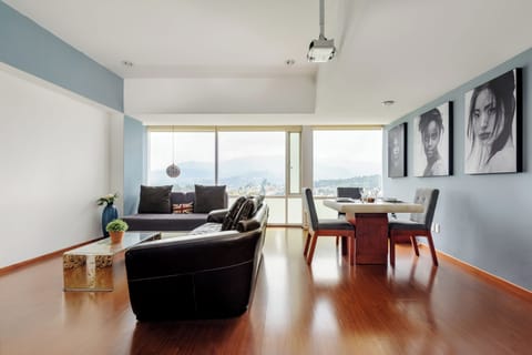 Design Apartment, 2 Bedrooms, City View, Tower | Living room | 50-inch Smart TV with digital channels