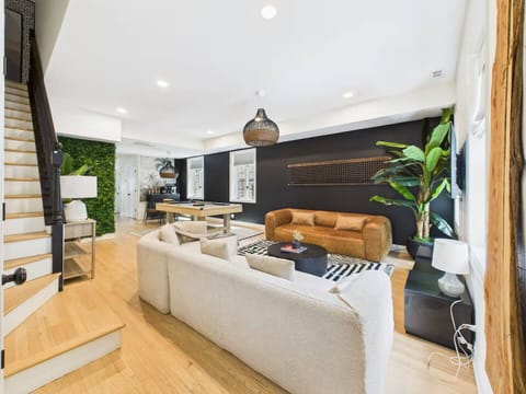 A designer loft lounge where rich textures meet play — cue up a game of pool or unwind in curated comfort after exploring Wicker Park.