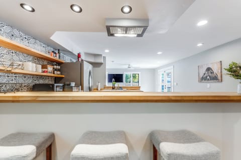 This house has an open concept making cooking, hosting and hanging out with friends easy | Interior