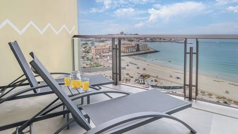 Twin chaise lounge chairs on the balcony