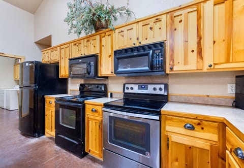 A well-equipped kitchen with double ovens and ample counter space makes hosting effortless and fun.