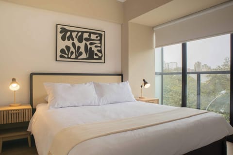 Bright bedroom with a large bed.