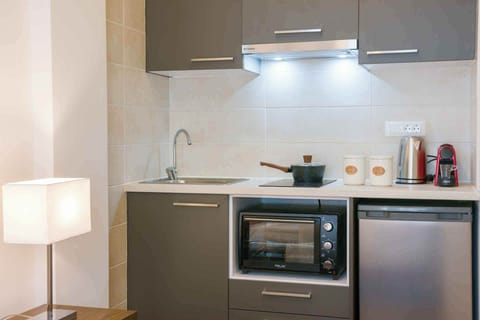 Comfort Studio, Balcony, Garden View | Private kitchen | Stovetop, espresso maker, toaster, highchair