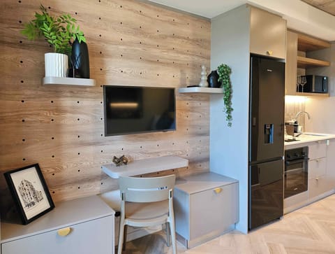 Compact Studio | Living area | 50-inch Smart TV with satellite channels, Netflix, streaming services