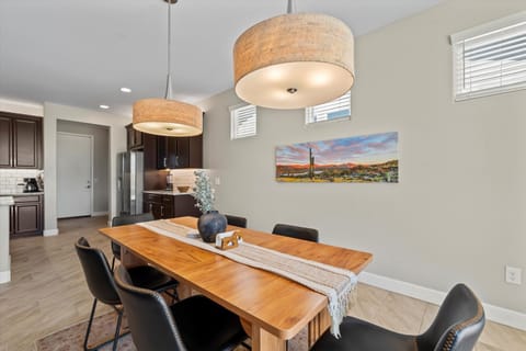 Gather around the dining table with seating for six, perfect for family meals, game nights, or entertaining friends in the heart of the home.