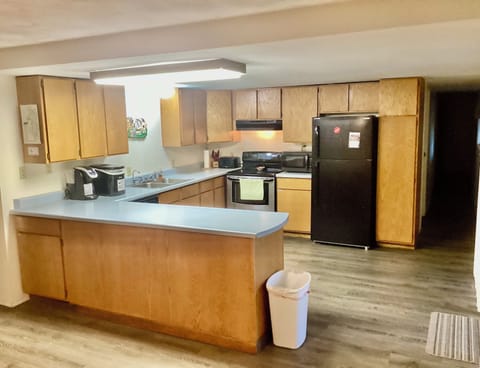 Kitchen is has electric range, ice maker, Keurig and dishwasher.