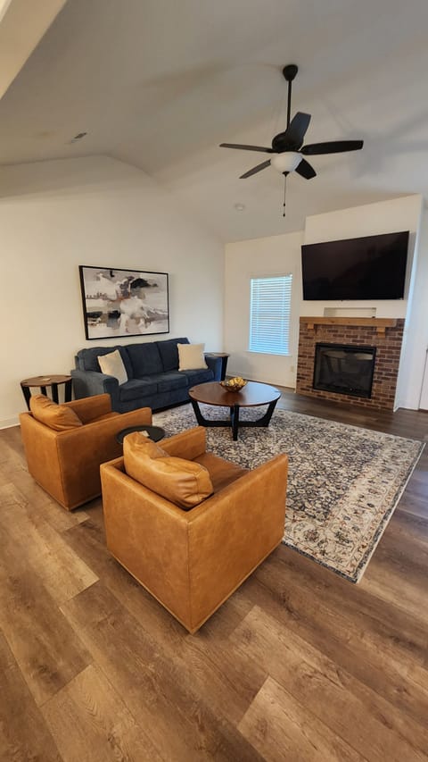 Spacious Living Room with pull out queen bed, and electric fireplace.