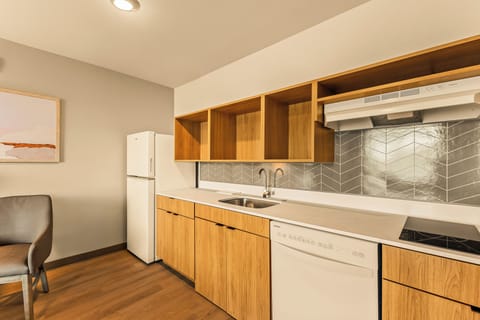Suite, 1 King Bed, Mobility Accessible, Non Smoking | Private kitchen | Full-size fridge, microwave, stovetop, dishwasher