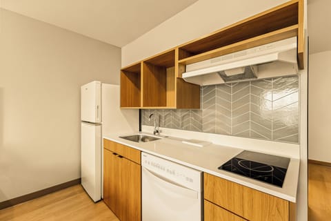 Suite, 2 Queen Beds, Mobility Accessible, Non Smoking | Private kitchen | Full-size fridge, microwave, stovetop, dishwasher