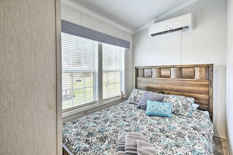 Cozy bedroom with large window and serene views