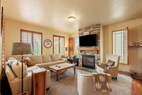 Comfortable living room with fireplace and cozy seating.