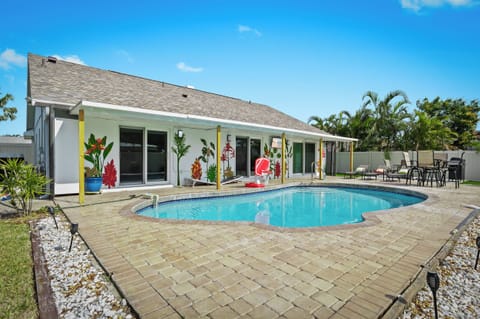 Private pool oasis with tropical murals and spacious patio seating