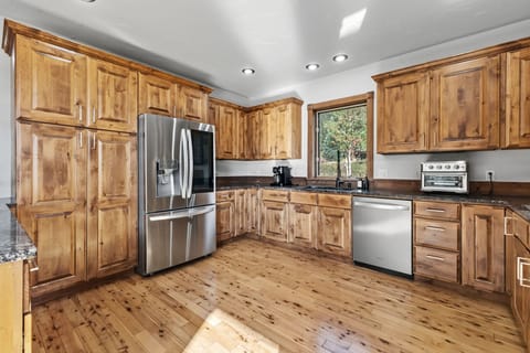 Kitchen: Drip coffee maker, Keurig, Crockpot, toaster oven, blender, cooking utensils, tableware