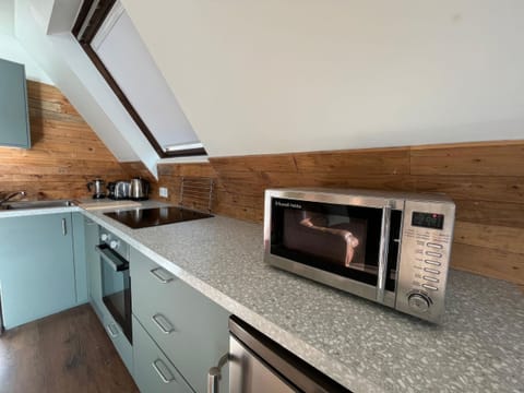 Kitchen area | Glenlude - Kylesku Lodges, Kylesku, near Lairg