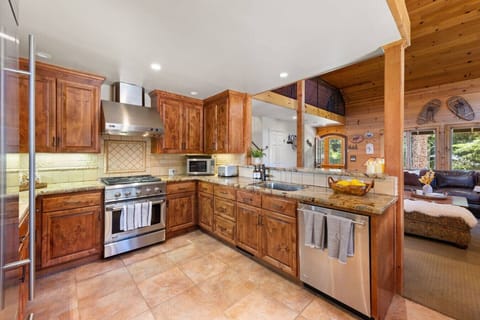 Fully stocked gourmet kitchen designed for shared meals and family/friend gatherings.