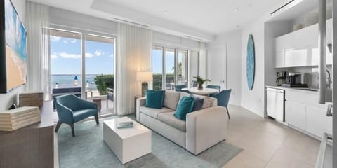 Living area with large windows for natural sunlight.