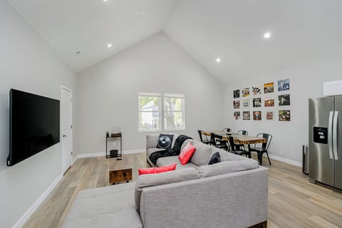 Cue the opening act: a spacious living room with a modern 65" LED 4K Smart TV