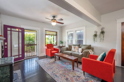 Living room features a confy sofa, a cozy fireplace, Google tv, board games