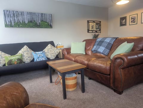 Open concept living room with wood burning fireplace