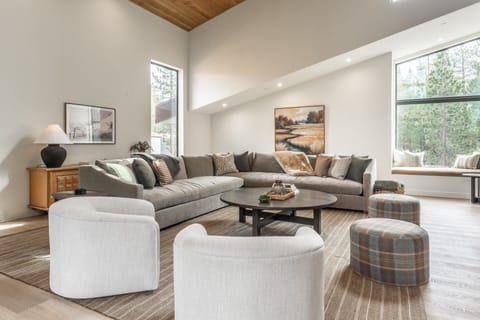 Living Room- Sectional Couch, 2 Arm Chairs, 2 Ottomans, Window Seat, Game table with Banquette Seating and 2 chairs Gas Linear Fireplace, Smart Flat Screen TV