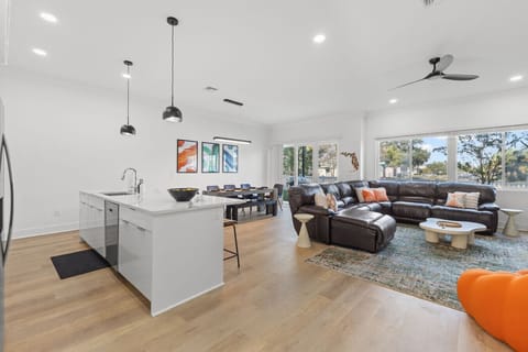 View of open layout with large windows, allowing for ample natural light