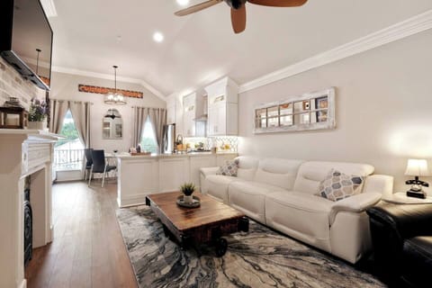 Living Area with extremely comfortable electric leather sofa and recliner.