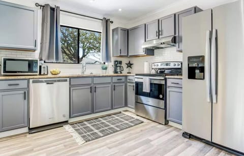 Stainless steel appliances with ice maker and filtered water.