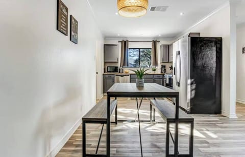 Transitional dining for 4 plus additional dining set for 4 on covered deck.