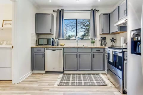 Everything you need to make memorable meals at home! Stainless steel appliances, cooking oils and spices, plus coffee bar.