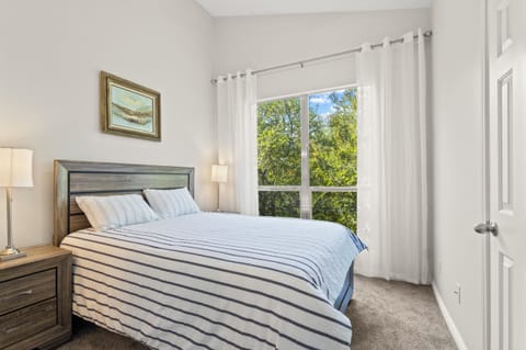Queen bedroom with garden view — your peaceful retreat